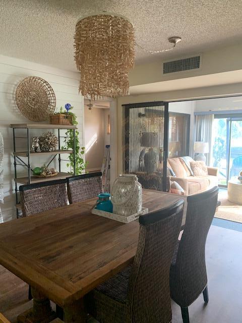 dining area featuring a textured ceiling