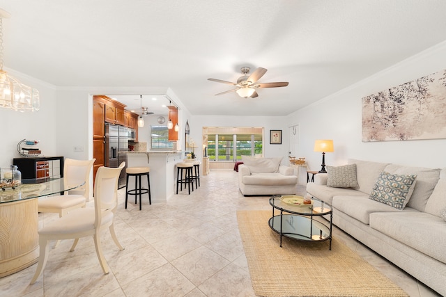 tiled living room featuring ceiling fan and ornamental molding