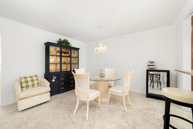 dining room featuring ornamental molding and a notable chandelier