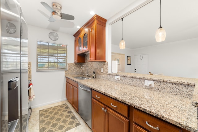 kitchen featuring ceiling fan, hanging light fixtures, sink, stainless steel dishwasher, and backsplash