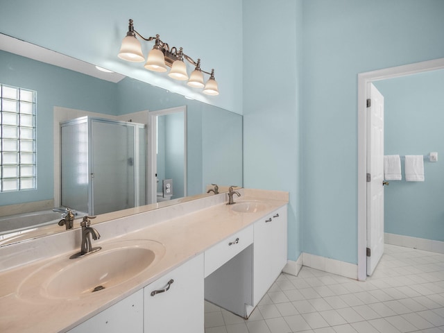 bathroom featuring vanity, an enclosed shower, and tile patterned floors