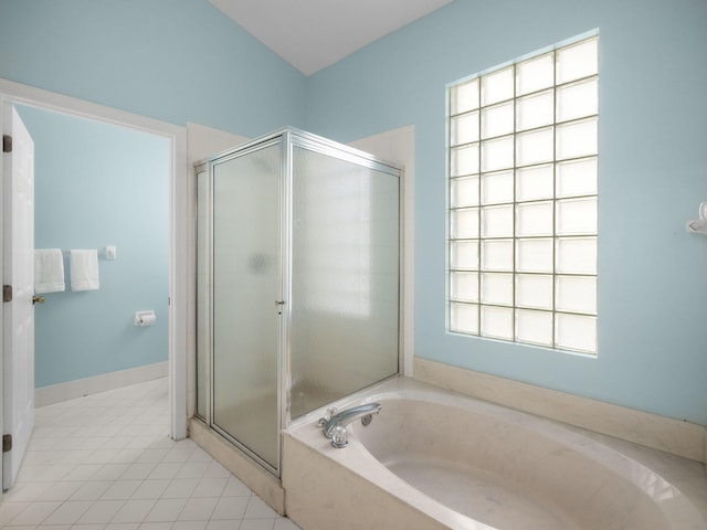 bathroom featuring plus walk in shower and tile patterned floors