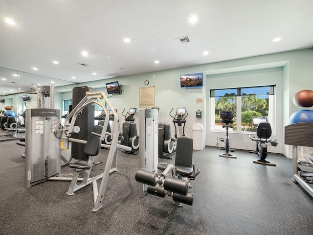 workout area with a textured ceiling