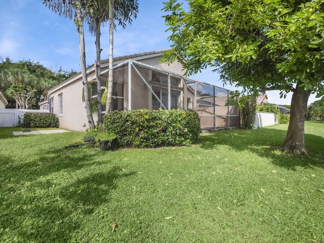 view of yard with a lanai