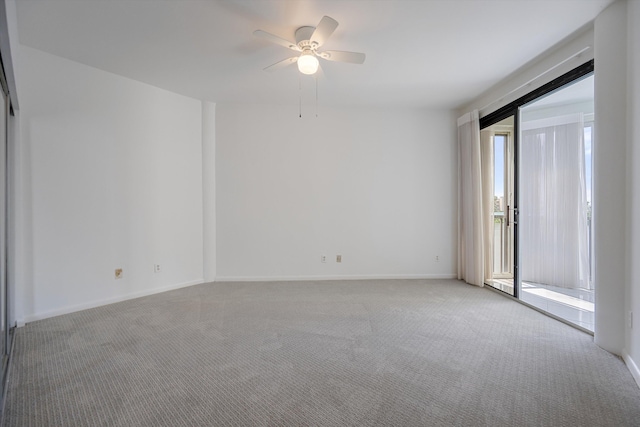 empty room with carpet floors and ceiling fan