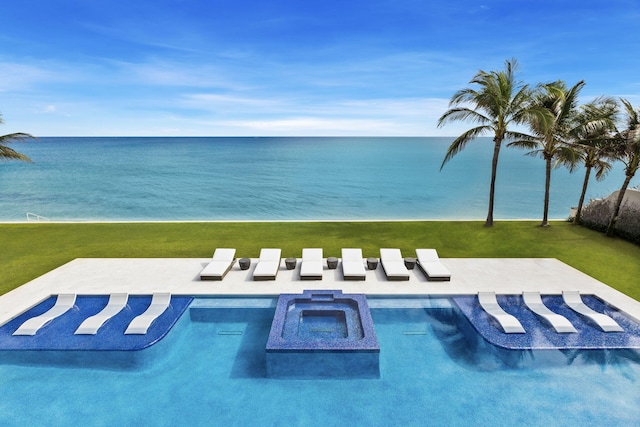 view of pool with a patio area, a yard, and a water view