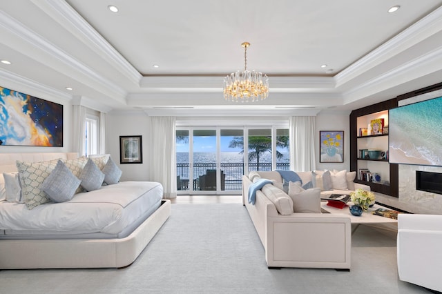 carpeted living room featuring ornamental molding, a notable chandelier, and a healthy amount of sunlight