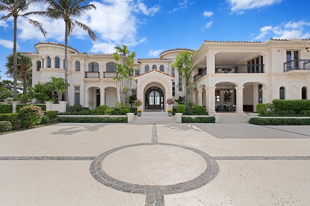 mediterranean / spanish-style house featuring a balcony