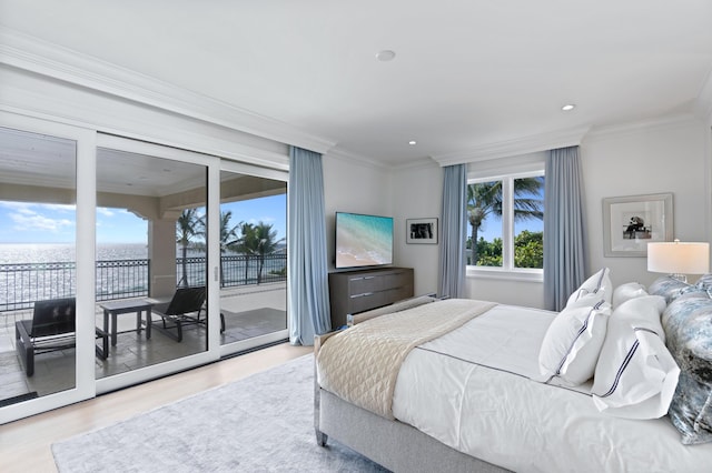 bedroom featuring light hardwood / wood-style flooring, access to outside, and ornamental molding