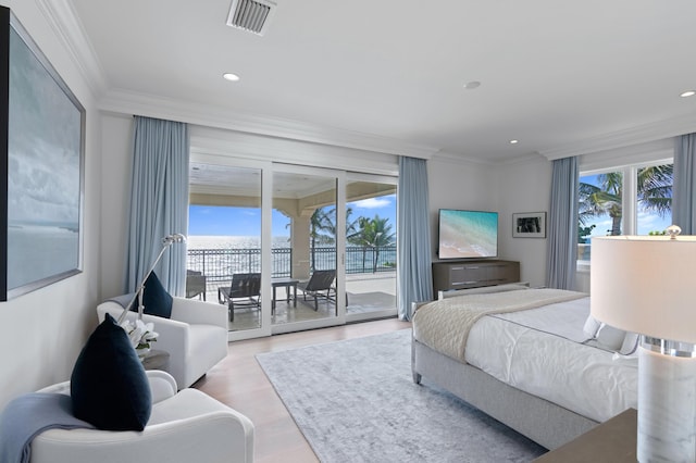 bedroom with ornamental molding, access to exterior, and light hardwood / wood-style floors