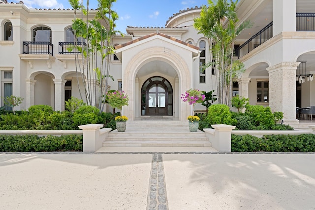 property entrance featuring french doors and a balcony