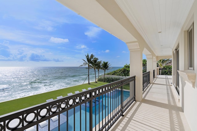 balcony featuring a water view