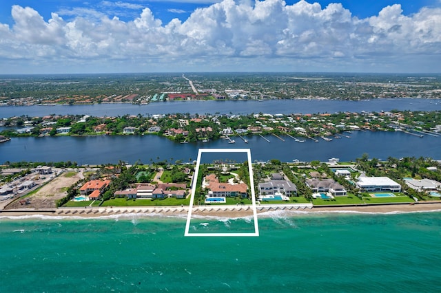 birds eye view of property featuring a view of the beach and a water view