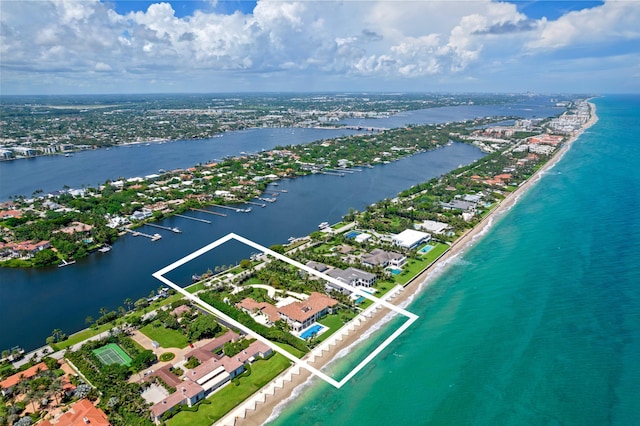 birds eye view of property featuring a water view and a view of the beach