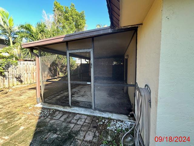 exterior space featuring a sunroom