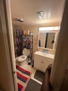 bathroom with vanity, a shower with shower curtain, toilet, and tile patterned floors