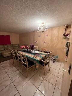 dining room featuring a textured ceiling, an inviting chandelier, and tile patterned flooring