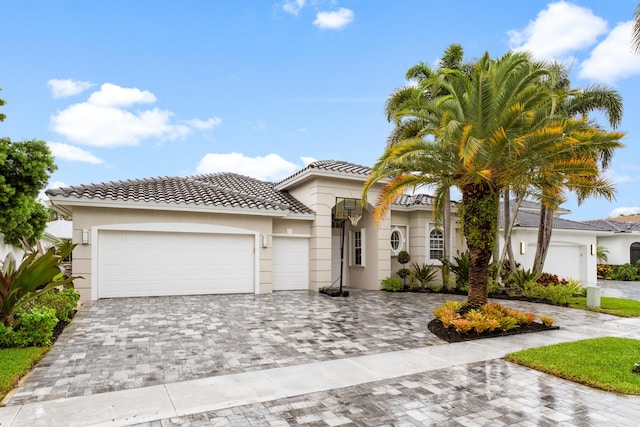 mediterranean / spanish-style house featuring a garage