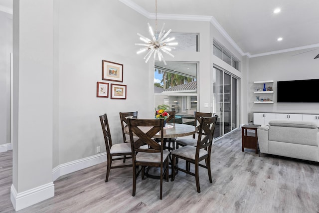 dining room featuring crown molding, a notable chandelier, and light wood-type flooring