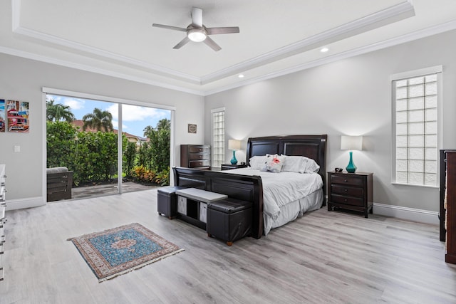 bedroom with light hardwood / wood-style floors, multiple windows, and ceiling fan