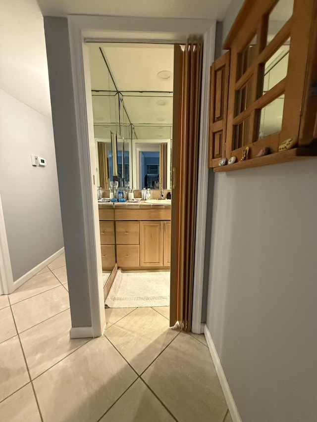 bathroom featuring tile patterned flooring and vanity