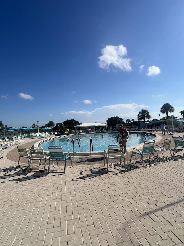 view of pool featuring a water view