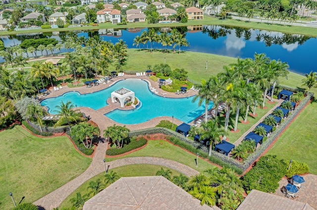 birds eye view of property with a water view