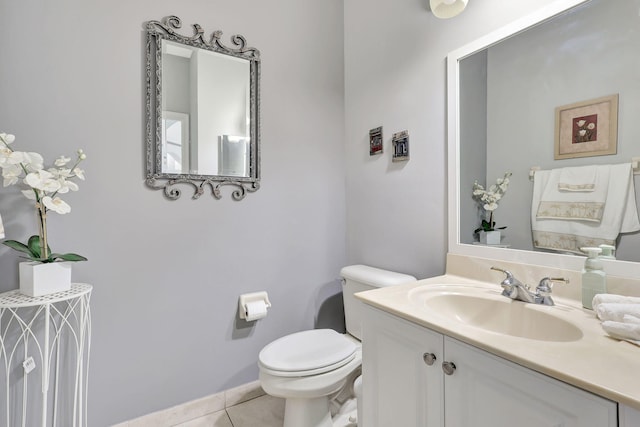 bathroom with vanity, toilet, and tile patterned floors