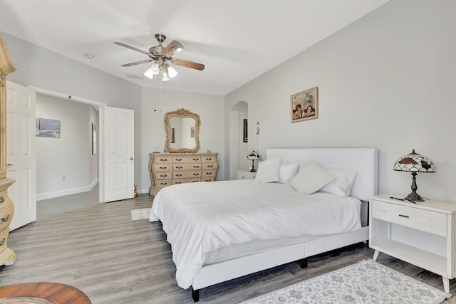 bedroom with hardwood / wood-style floors and ceiling fan