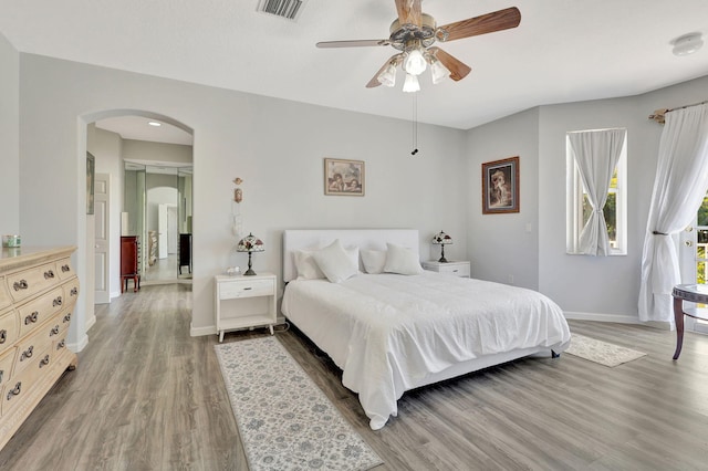 bedroom featuring wood-type flooring and ceiling fan