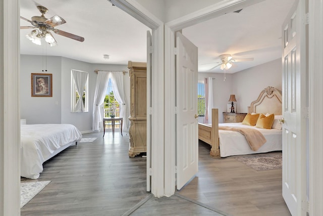 bedroom with ceiling fan and hardwood / wood-style floors