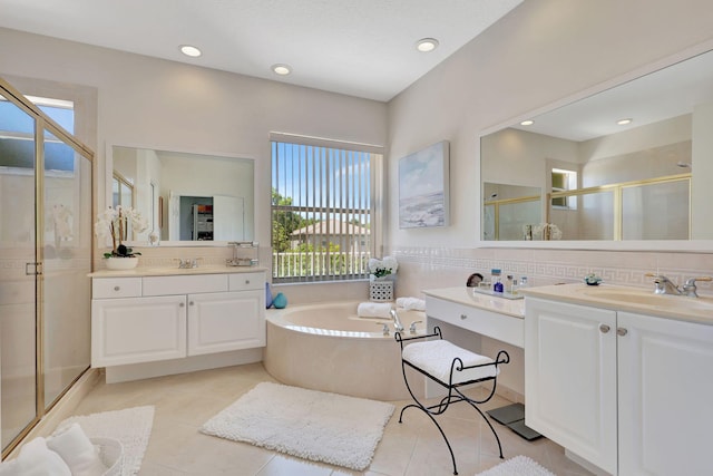 bathroom featuring vanity, plus walk in shower, tasteful backsplash, and tile patterned flooring