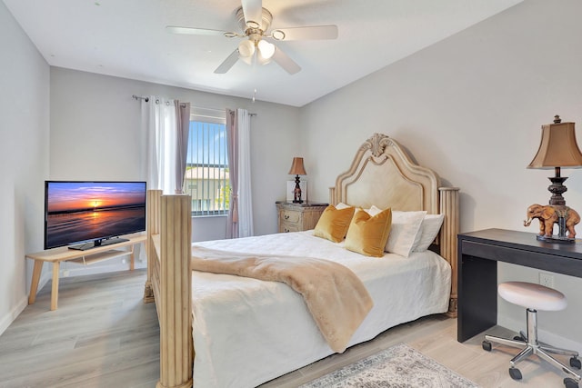 bedroom featuring ceiling fan and light hardwood / wood-style flooring