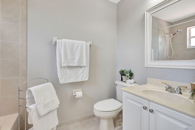 full bathroom featuring toilet, tiled shower / bath, vanity, and tile patterned floors