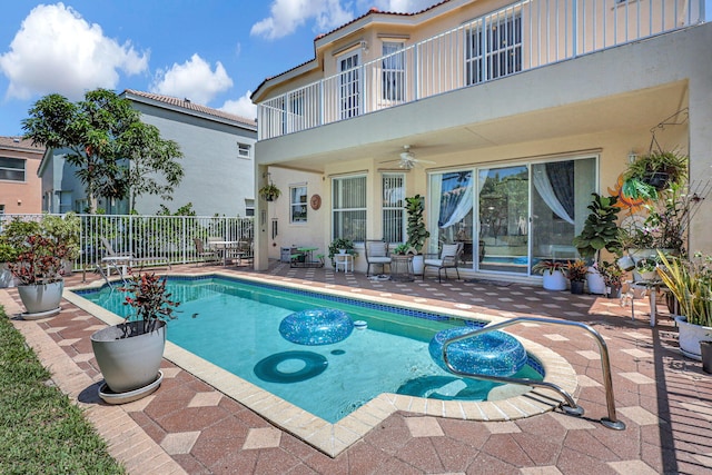 view of pool featuring a patio area and ceiling fan