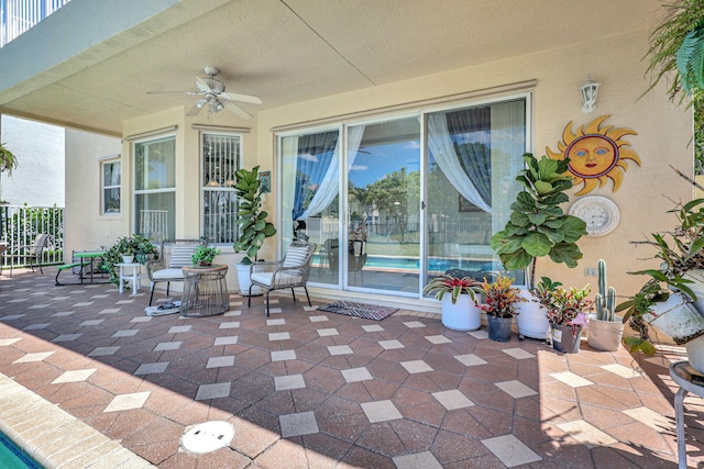 view of patio featuring ceiling fan