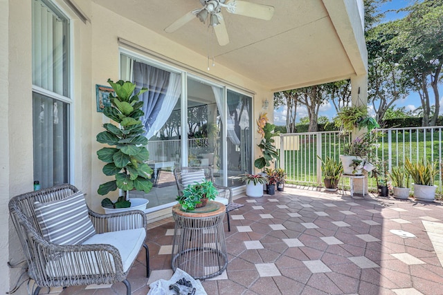 view of patio featuring ceiling fan