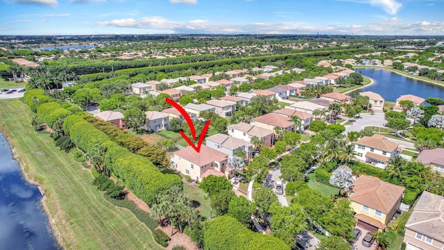 birds eye view of property featuring a water view