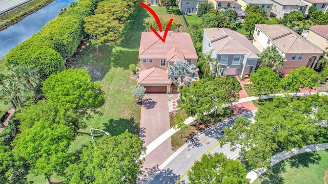 birds eye view of property featuring a water view