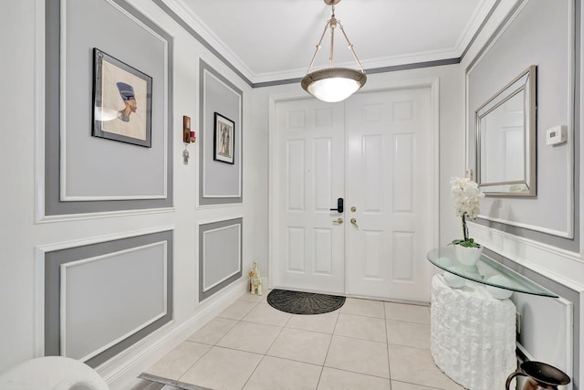 tiled entrance foyer with crown molding