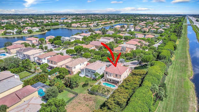 birds eye view of property featuring a water view