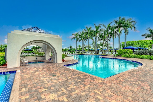 view of swimming pool featuring a patio