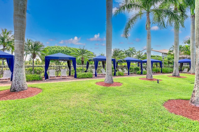 view of property's community with a gazebo and a lawn