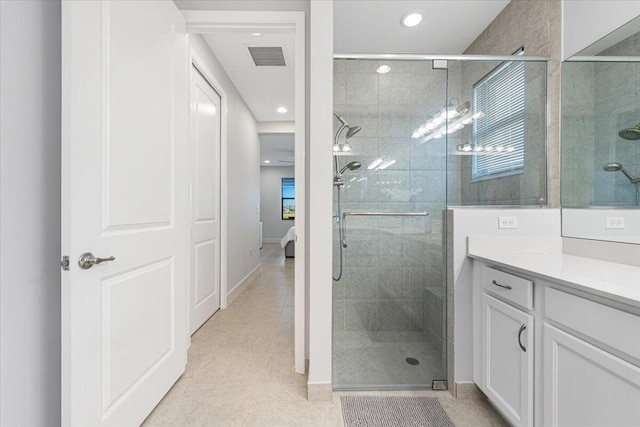 bathroom with vanity and an enclosed shower