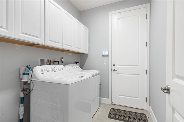 laundry room with cabinets and separate washer and dryer