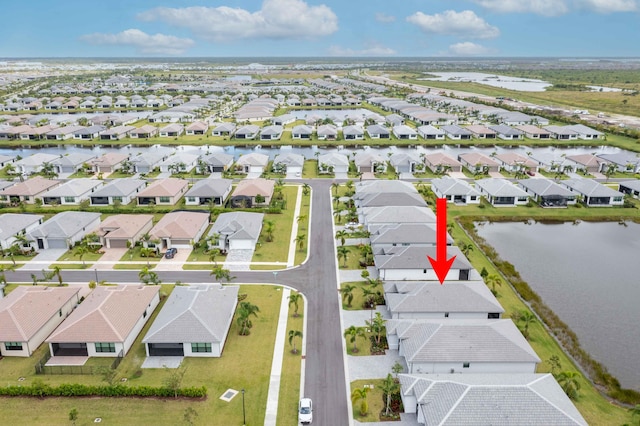 aerial view featuring a water view and a residential view