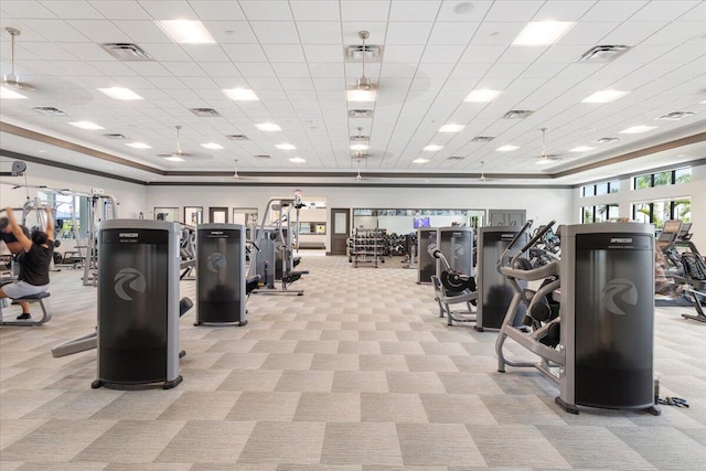 exercise room with light carpet