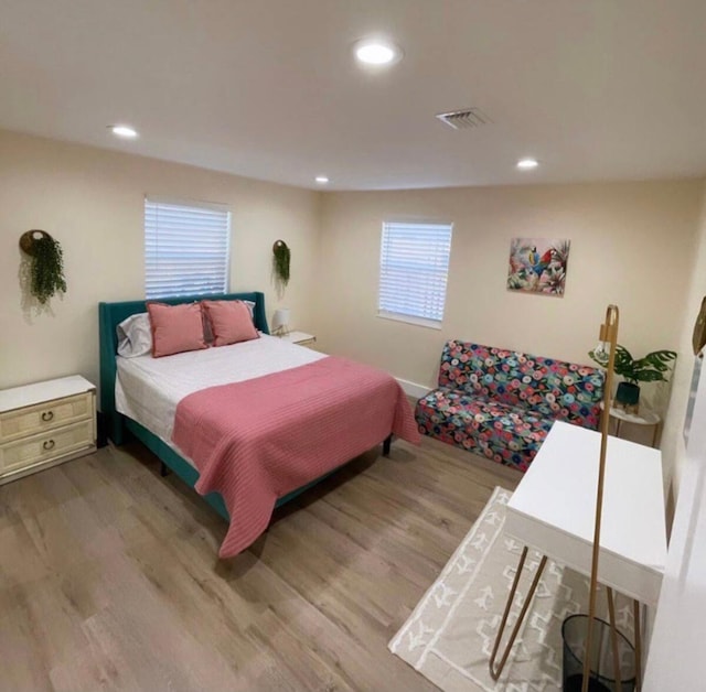 bedroom with light hardwood / wood-style floors