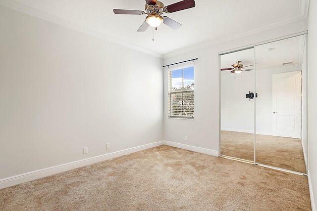 bedroom featuring ceiling fan, ornamental molding, a tray ceiling, and light hardwood / wood-style floors