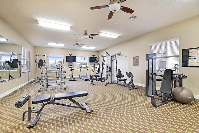 gym with a textured ceiling